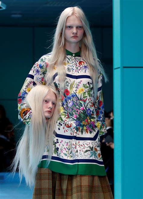 gucci fashion girl holding head|Models Carried Their Own Severed Heads At Gucci's Fashion Show.